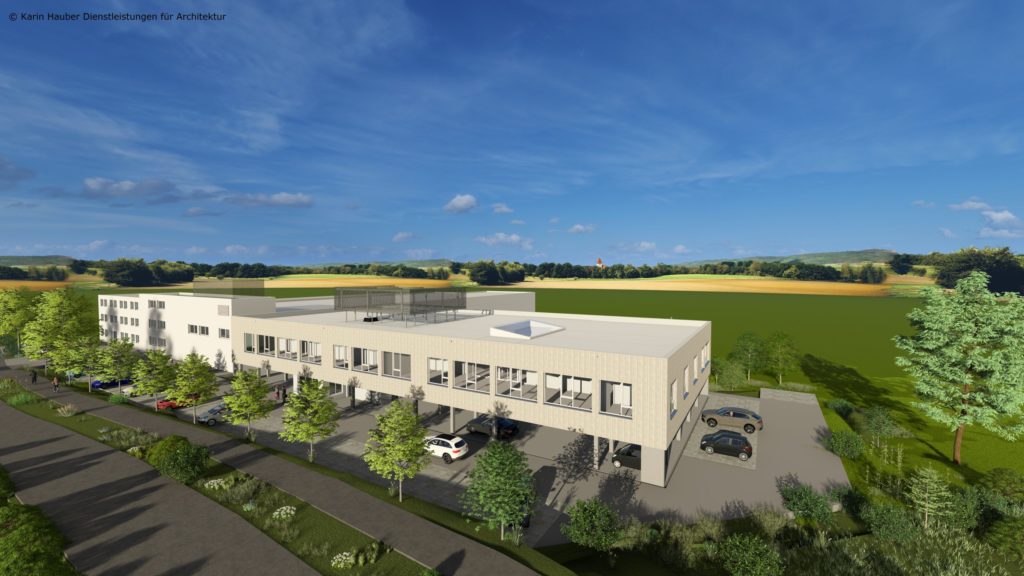 Erweiterte Produktionshalle und neues Bürogebäude in ländlicher Umgebung mit Parkplätzen und Grünflächen.